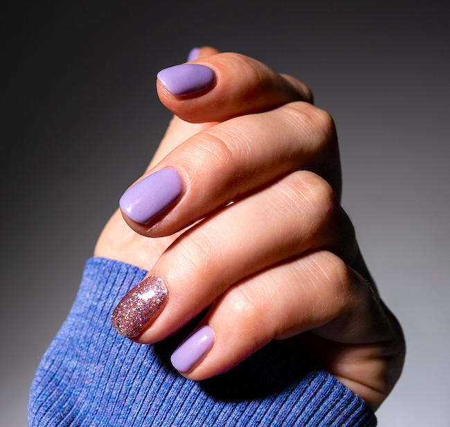 Short lavender sparkle nails.